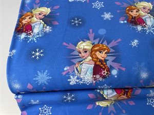 Bomuldsjersey - Elsa og Anna på klar blå bund med snefnug